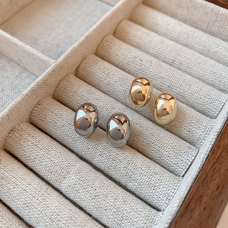 Gold and silver bean stud earrings