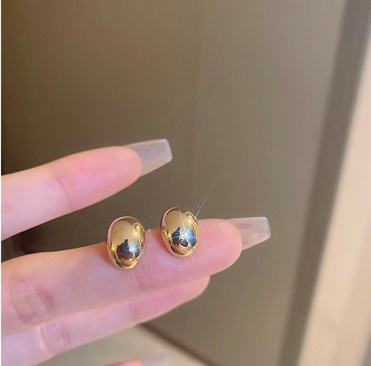 Gold and silver bean stud earrings